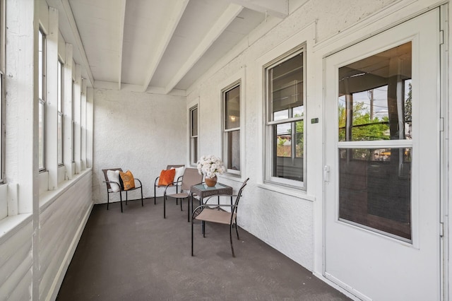 sunroom / solarium with beamed ceiling
