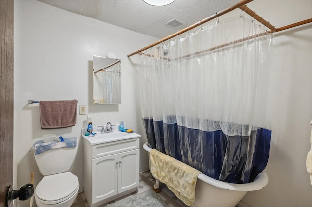 bathroom with vanity, toilet, a textured ceiling, a shower with curtain, and visible vents