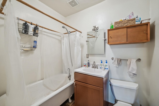 bathroom featuring visible vents, shower / tub combo with curtain, toilet, and vanity