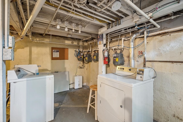 clothes washing area with laundry area and washer and dryer