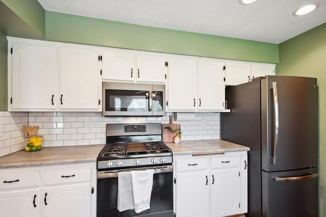kitchen featuring white cabinets and stainless steel appliances