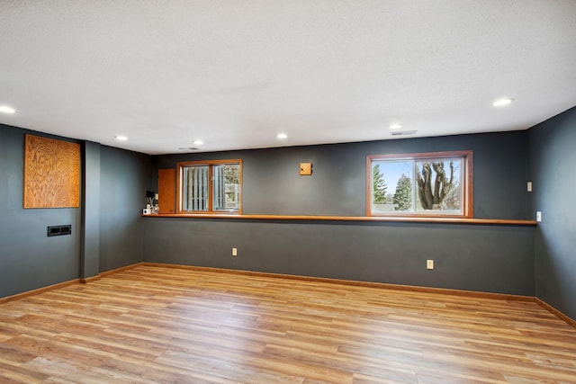 below grade area with recessed lighting and wood finished floors