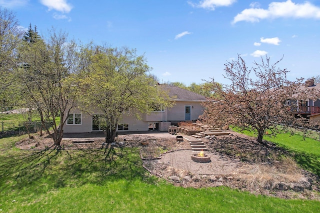 view of yard featuring a patio and a fire pit