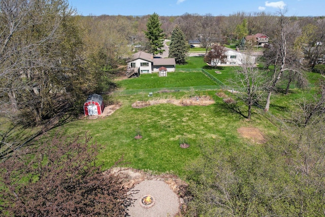 aerial view featuring a wooded view