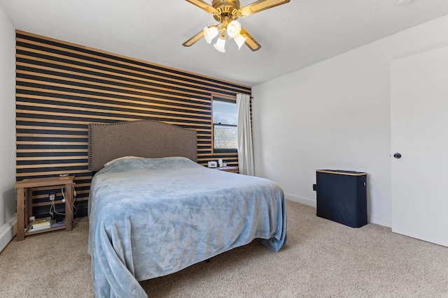 carpeted bedroom featuring baseboards, a ceiling fan, and wallpapered walls