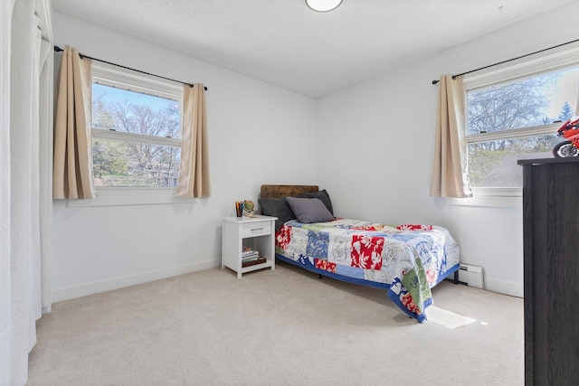 carpeted bedroom featuring baseboards, a baseboard radiator, and multiple windows