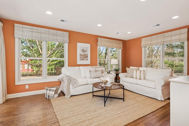 living room with visible vents, recessed lighting, and a healthy amount of sunlight