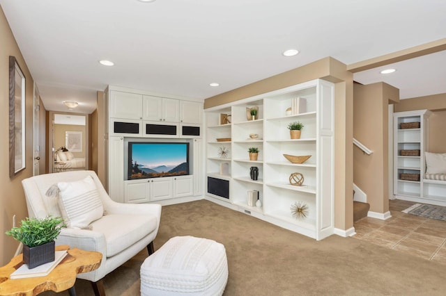 living room featuring stairs, recessed lighting, baseboards, and light carpet