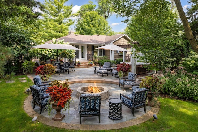 view of patio with a fire pit and entry steps