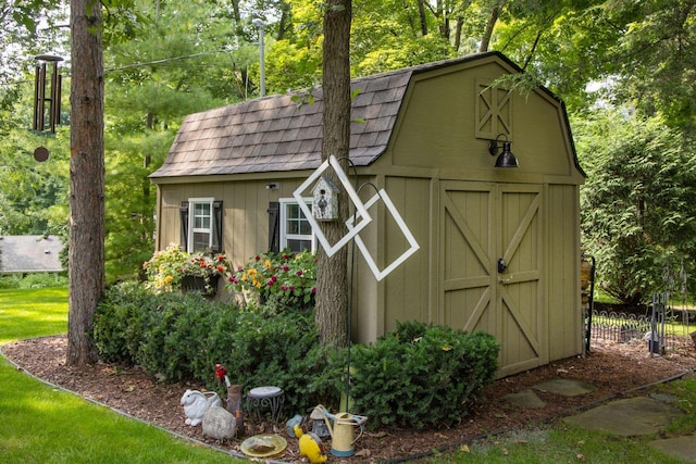 view of shed with fence
