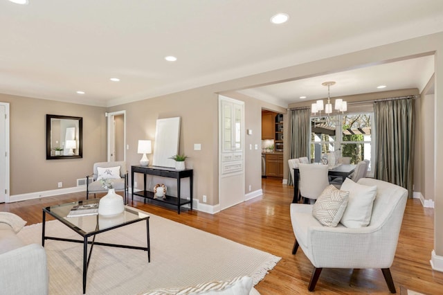 17001 The Strand, Minnetonka, MN 55345 - living room with a chandelier, baseboards, light wood-style flooring, and recessed lighting
