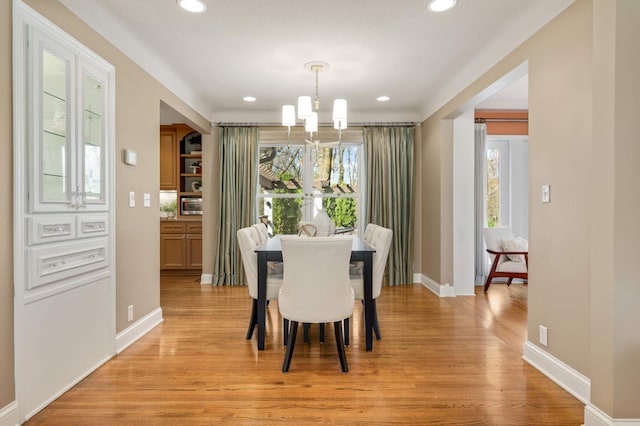 17001 The Strand, Minnetonka, MN 55345 - dining area with a chandelier, light wood-style floors, recessed lighting, and baseboards
