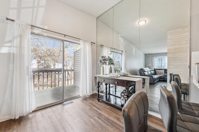 dining room with visible vents and wood finished floors
