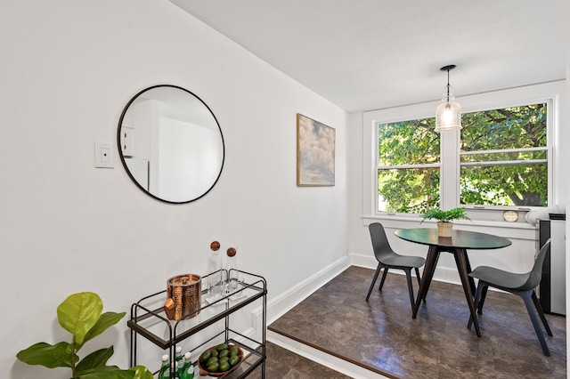 dining area featuring baseboards
