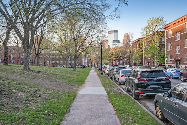 exterior space with sidewalks and street lights