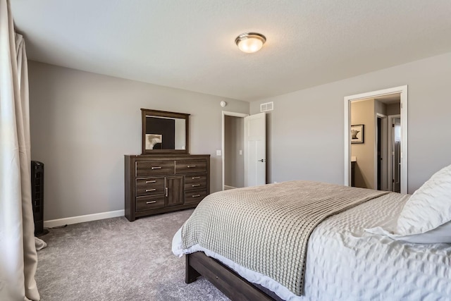 bedroom featuring visible vents, baseboards, and carpet floors