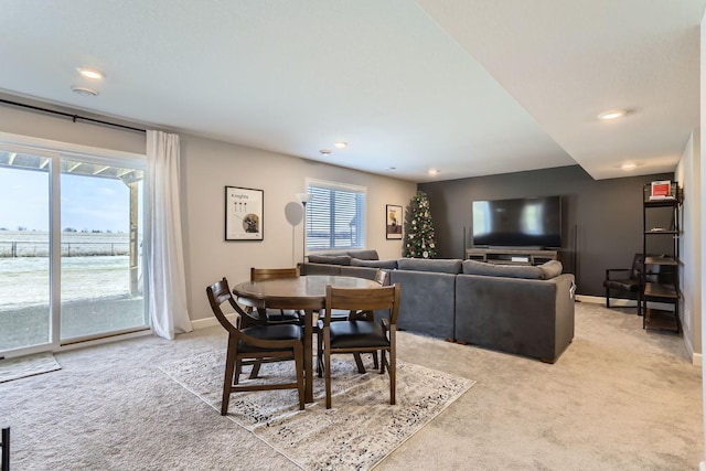 dining room featuring baseboards, recessed lighting, and light colored carpet