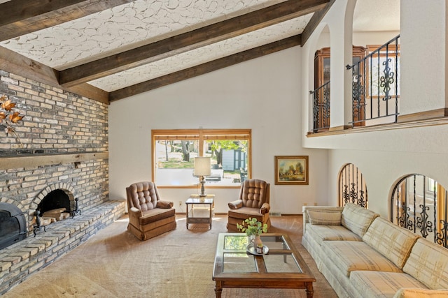 carpeted living area with high vaulted ceiling, beam ceiling, arched walkways, and a brick fireplace