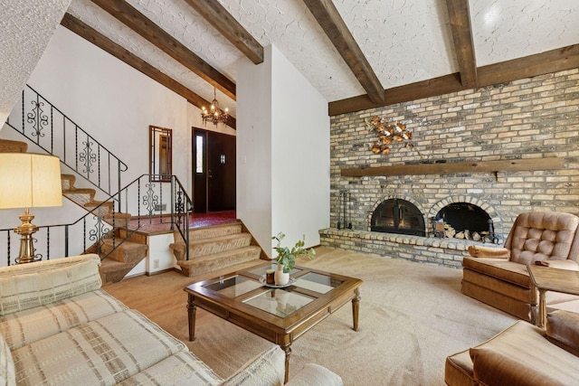 carpeted living area featuring a chandelier, a fireplace, and stairs
