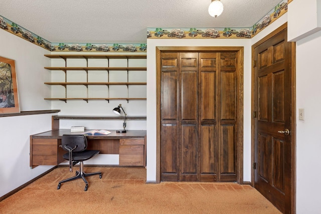office featuring light carpet, a textured ceiling, and baseboards