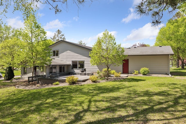 rear view of property with a yard