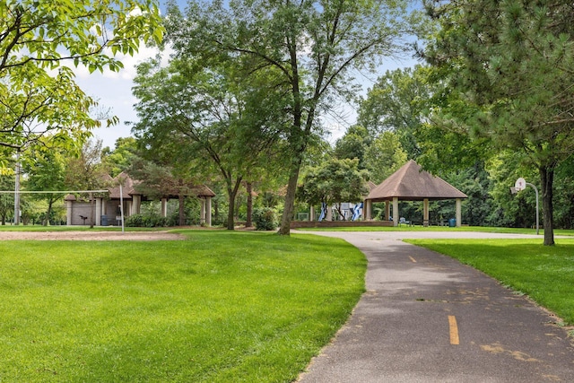surrounding community featuring a gazebo and a lawn