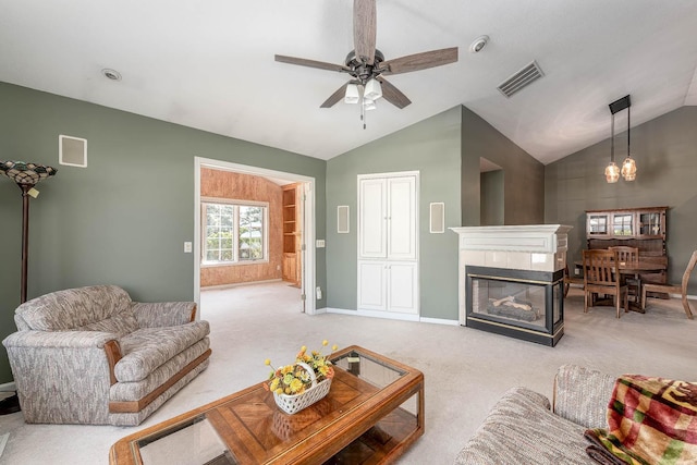 267 Plum Run, Le Sueur, MN 56058 - living room featuring light colored carpet, visible vents, vaulted ceiling, and ceiling fan with notable chandelier