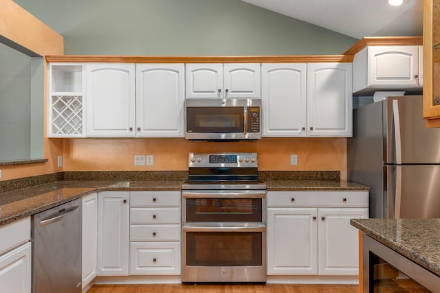 267 Plum Run, Le Sueur, MN 56058 - kitchen with white cabinetry, appliances with stainless steel finishes, and vaulted ceiling