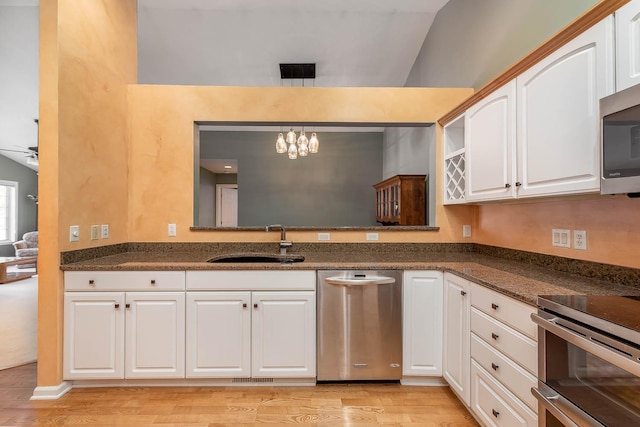 267 Plum Run, Le Sueur, MN 56058 - kitchen featuring white cabinets, appliances with stainless steel finishes, a sink, and light wood-style floors