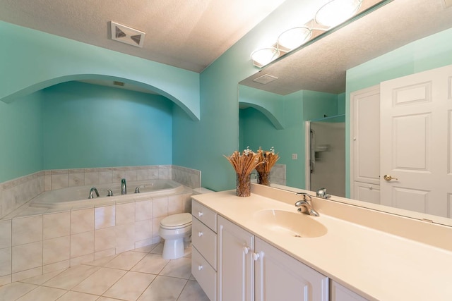 267 Plum Run, Le Sueur, MN 56058 - bathroom with visible vents, a garden tub, tile patterned flooring, vanity, and a textured ceiling