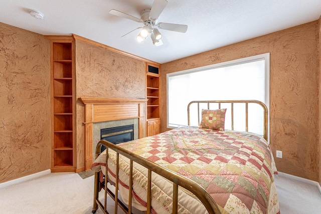 267 Plum Run, Le Sueur, MN 56058 - bedroom with a fireplace, baseboards, a textured wall, and carpet