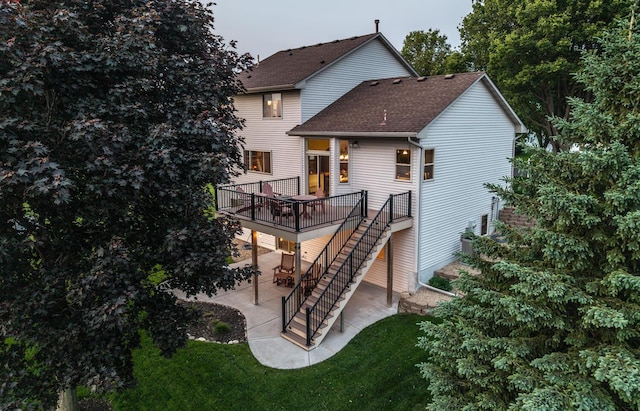 19288 Evenston Dr, Farmington, MN 55024 - rear view of property featuring a patio area, stairway, a deck, a shingled roof, and a yard