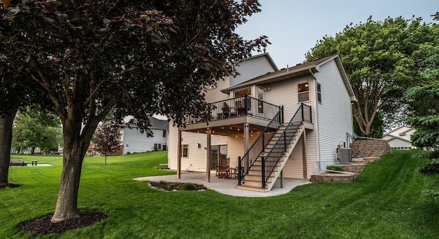 19288 Evenston Dr, Farmington, MN 55024 - rear view of property featuring a patio area, a deck, stairway, a lawn, and central AC