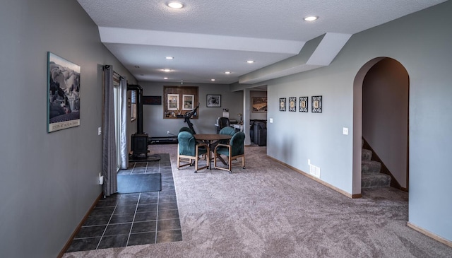 19288 Evenston Dr, Farmington, MN 55024 - dining area featuring dark colored carpet, baseboards, stairway, recessed lighting, and arched walkways
