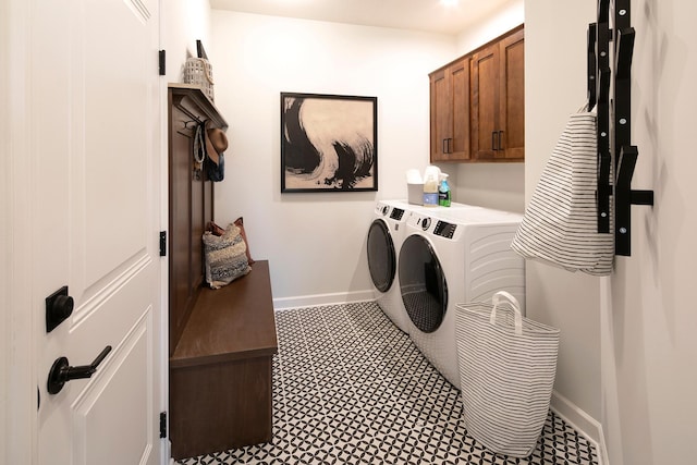 9750 65th St S, Cottage Grove, MN 55016 - laundry room with cabinet space, baseboards, and washer and clothes dryer