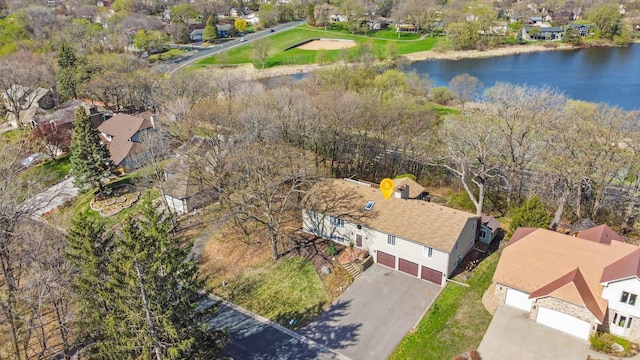 birds eye view of property featuring a residential view and a water view