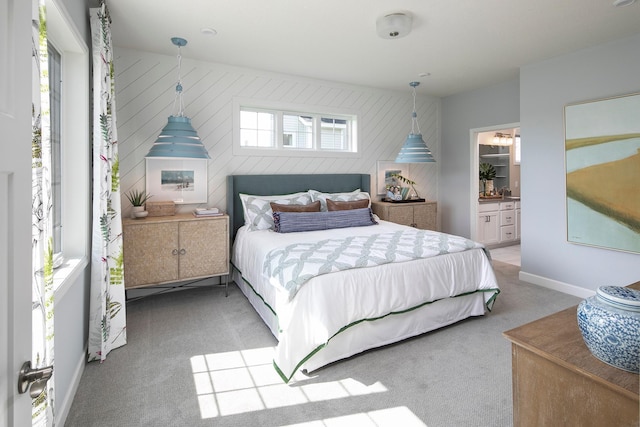 2717 Kalland Ave NE, Saint Michael, MN 55376 - bedroom featuring light carpet, ensuite bathroom, and baseboards