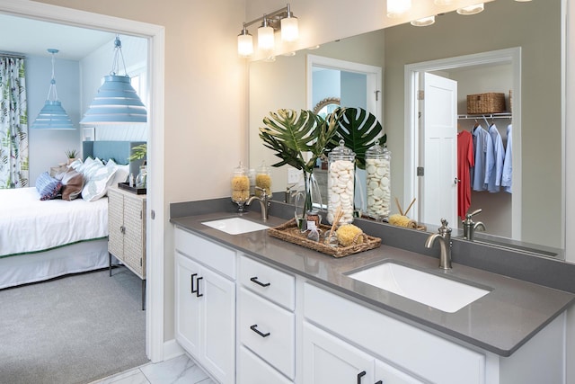 2717 Kalland Ave NE, Saint Michael, MN 55376 - full bath with double vanity, marble finish flooring, and connected bathroom
