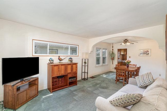 4528 30th Ave S, Minneapolis, MN 55406 - carpeted living room with arched walkways and a ceiling fan