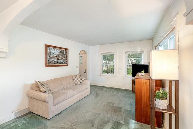 4528 30th Ave S, Minneapolis, MN 55406 - living area featuring arched walkways and carpet flooring