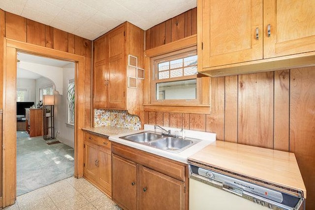4528 30th Ave S, Minneapolis, MN 55406 - kitchen with dishwasher, plenty of natural light, light countertops, arched walkways, and wood walls