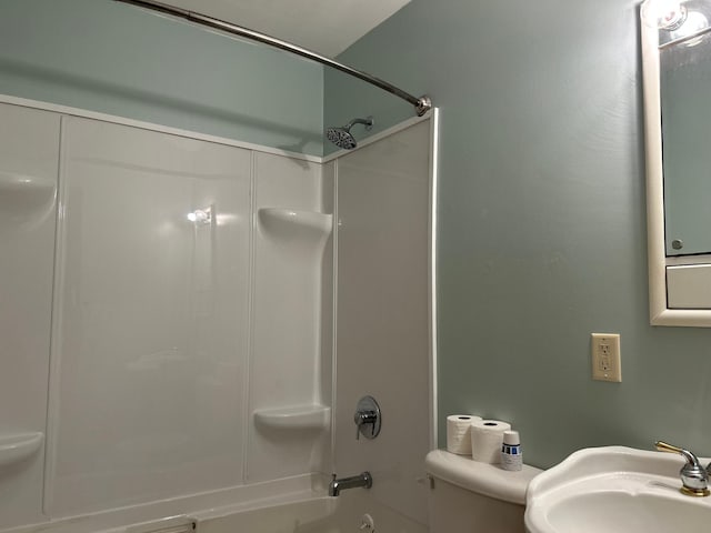 full bath with toilet, shower / washtub combination, and a sink