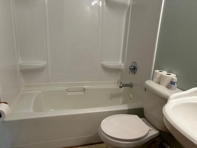 full bath with toilet, shower / bath combination, and a sink