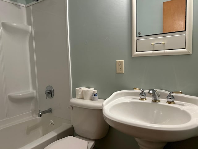 full bathroom with toilet,  shower combination, and a sink