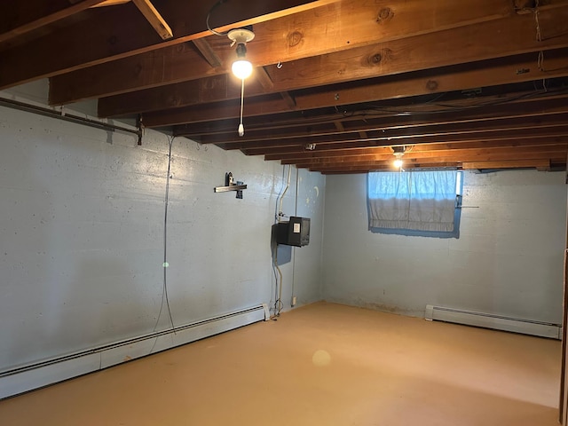 below grade area with a baseboard heating unit