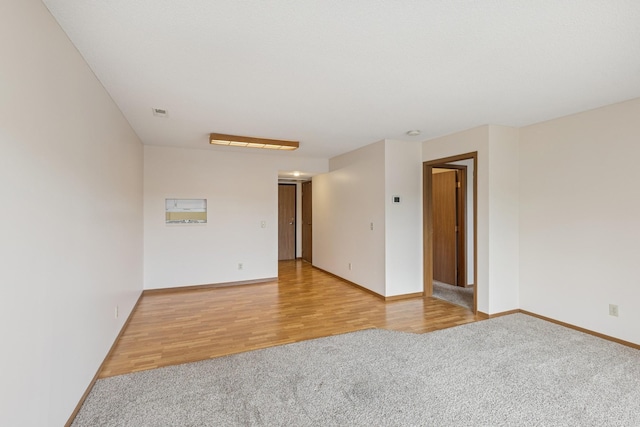 14575 Burma Ave W Unit 202, Rosemount, MN 55068 - spare room featuring light colored carpet, baseboards, and light wood-type flooring