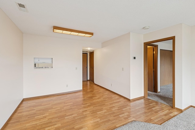 14575 Burma Ave W Unit 202, Rosemount, MN 55068 - spare room featuring light wood finished floors, baseboards, and a smoke detector
