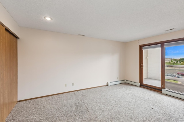 14575 Burma Ave W Unit 202, Rosemount, MN 55068 - spare room featuring a baseboard heating unit, carpet floors, a textured ceiling, baseboards, and recessed lighting