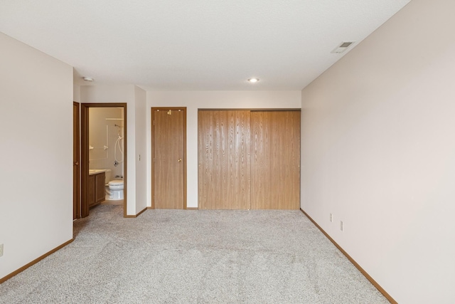 14575 Burma Ave W Unit 202, Rosemount, MN 55068 - unfurnished bedroom featuring multiple closets, light colored carpet, baseboards, and ensuite bathroom