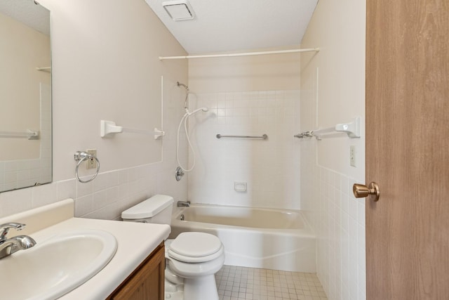 14575 Burma Ave W Unit 202, Rosemount, MN 55068 - bathroom featuring tile walls, toilet, vanity, shower / tub combination, and tile patterned flooring